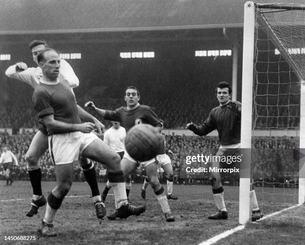 Tough moment for Ronnie Moran the Liverpool left when facing his own goal being tackled by Jones, Spurs winger. Tommy Lawrence the Goalkeeper and Ian...
