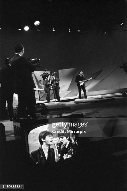 The Beatles in New York rehearse for their appearance on the Ed Sullivan TV Show. On stage left to right: Ringo Starr, Paul McCartney, George...