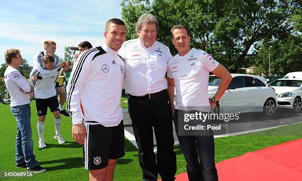Lukas Podolski , Norbert Haug and Nico Rosberg are pictured at Stadium Torrettes on May 23, 2012 in Torrettes Sur Loup, France. Director of Mercedes...