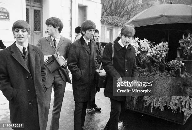 The Beatles walk about in Paris, France during their tour. Left to right: Ringo Starr, Paul McCartney, George Harrison and John Lennon. 15th January...