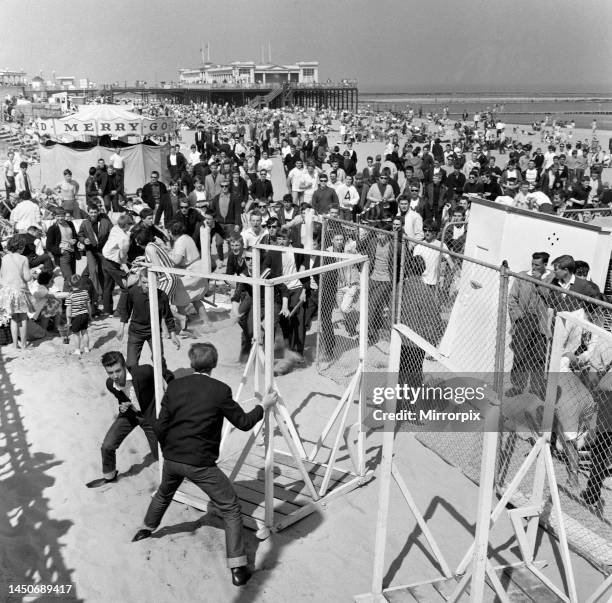 Mods and Rockers clash at Margate sea front. They were fighting on the beach the town centre and in the theme park 'Dreamland'. 20th May 1964.