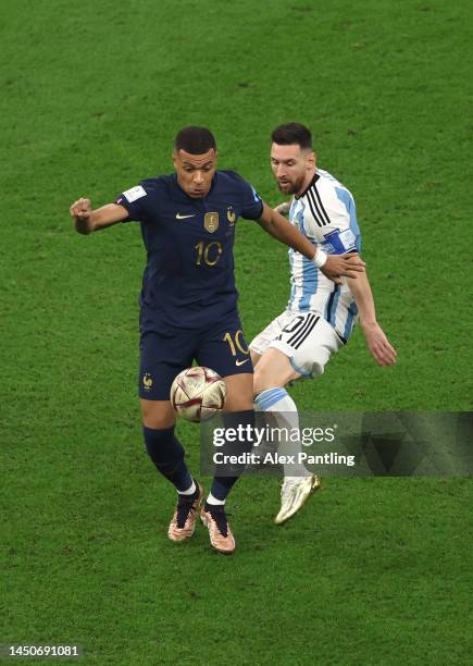 Lionel Messi of Argentina closes down Kylian Mbappe of France during the FIFA World Cup Qatar 2022 Final match between Argentina and France at Lusail...