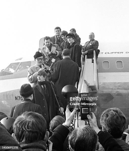 The Beatles say goodbye to the press as they board a plane bound for New York. 7th February 1964.