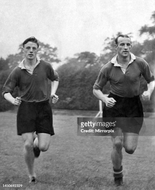 Albert Scanlon and Allenby Chilton of Manchester United in training. August 1954.