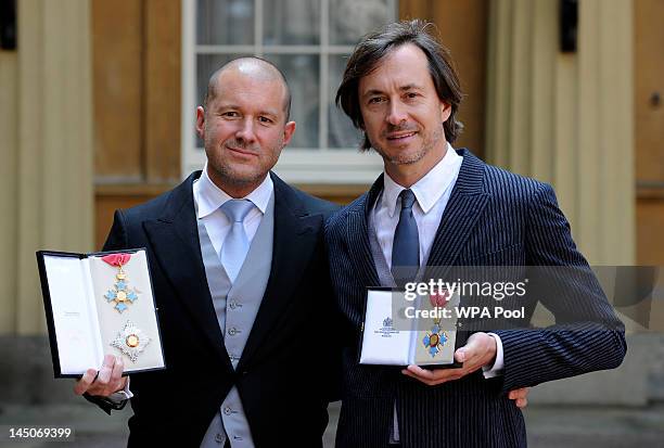 Sir Jonathan Ive, Senior Vice President, Industrial Design, Apple Inc poses with his Honour of Knighthood and designer Mark Newson poses with his...