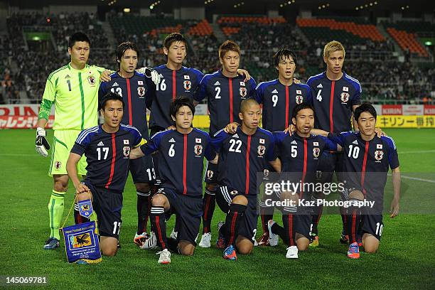 Japan players line up for team photos prior to the international friendly match between Japan and Azerbaijan at Ecopa Stadium on May 23, 2012 in...