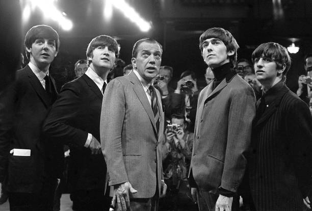 The Beatles with television host Ed Sullivan. 9th February 1964.