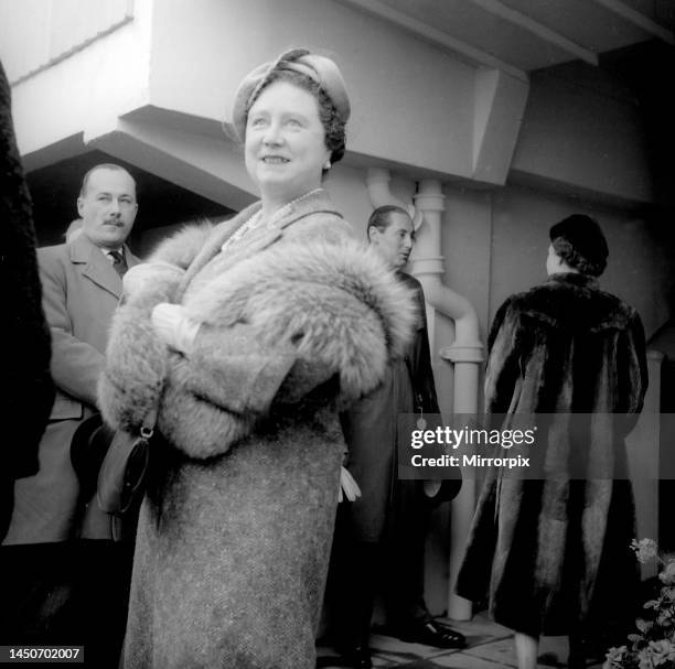 Queen Elizabeth the Queen Mother at Cheltenham racecourse in 1956 wearing fur stole over her coat, March 1956.