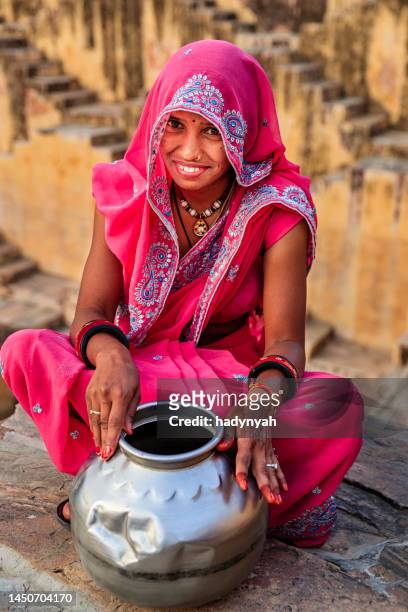 indian woman in village near jaipur, india - stepwell india stock pictures, royalty-free photos & images