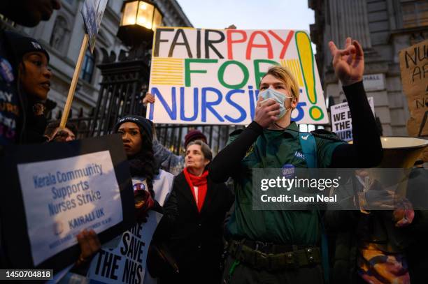 An ambulance paramedic makes a speech as NHS workers and supporters gather outside Downing Street to protest during the second day of strike action...