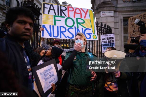 An ambulance paramedic makes a speech as NHS workers and supporters gather outside Downing Street to protest during the second day of strike action...