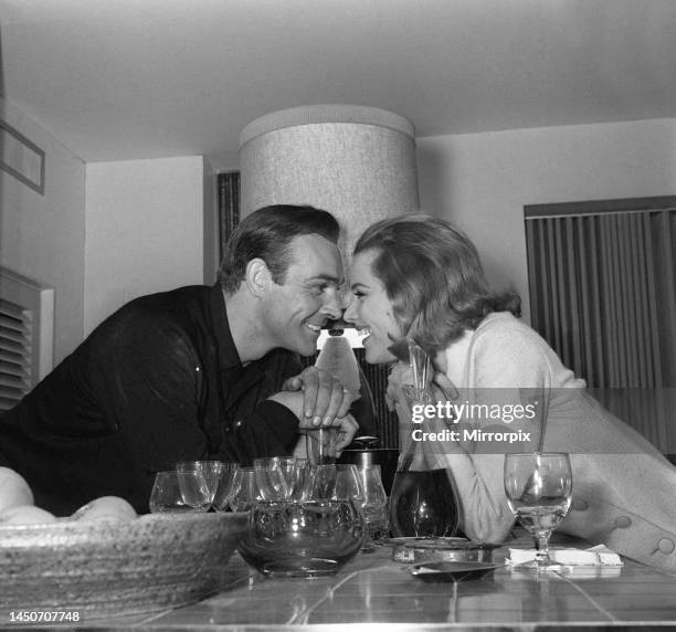 Sean Connery with Honor Blackman on the set of the film Goldfinger. 26th March 1964.