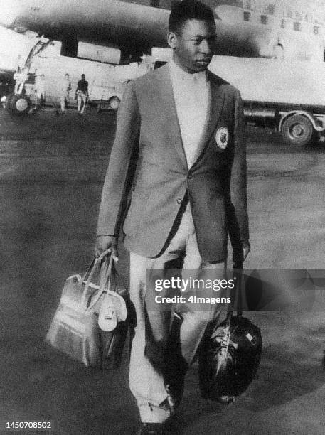 Year old Pelé at an airport during his first trip to Sweden in 1956.