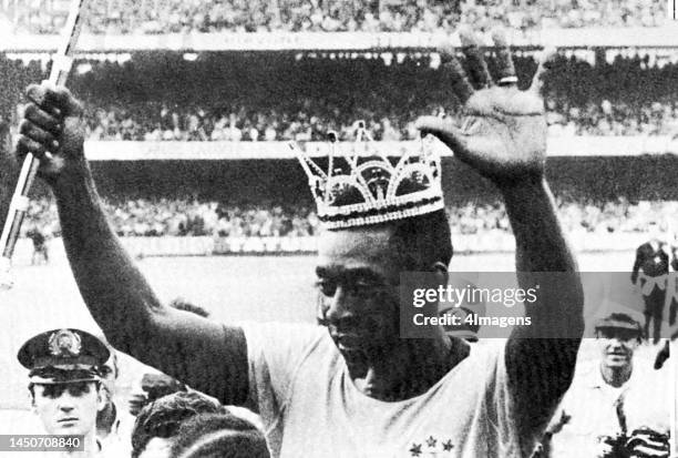 Pelé wears a crown and holds a scepter as Brazil are crowned champions at the 1970 FIFA World Cup in Mexico.