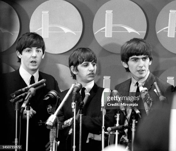 The Beatles answer questions for newsmen and journalists in New York after their arrival for their first tour of America. Left to right: Paul...