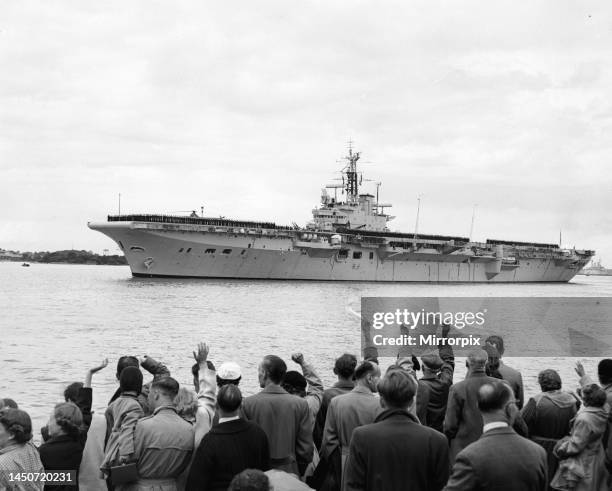 Suez Crisis 1956 - The Aircraft Carrier HMS Theseus sails for the Mediterranean from Portsmouth cheared on by the relatives of the soldiers and...