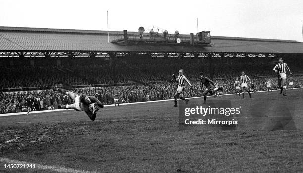 Sunderland goalkeeper Jim Montgomery dives spectacularly to make a fine save from Manchester United's George Best during their league match at Roker...