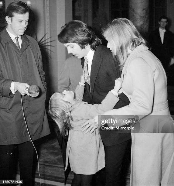 Paul McCartney and Linda Eastman being interviewed after their wedding reception at the Ritz Hotel, London, 12 March 1969.