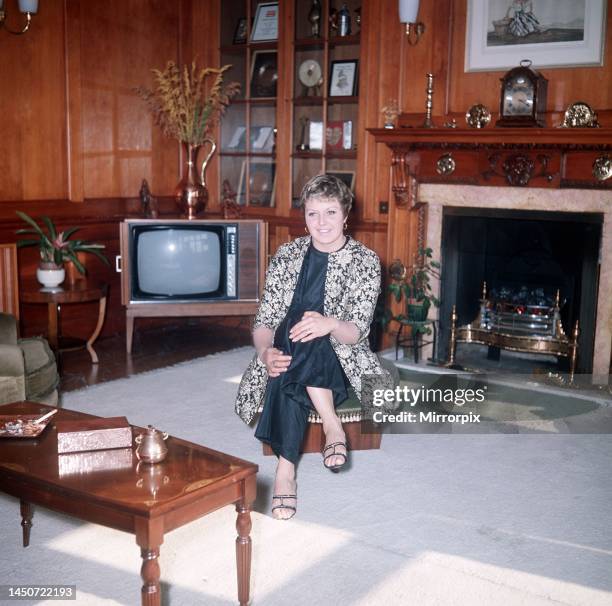 Linda Jones, wife of Singer Tom Jones, sitting down in the living room at their home.