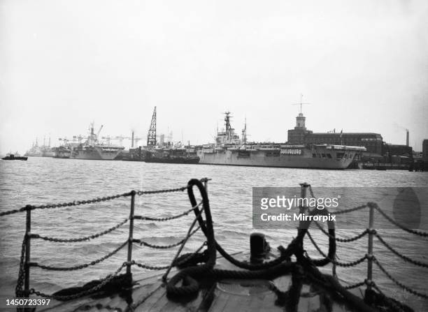 Suez Crisis 1956 - , The aircraft carriers HMS Theseus and HMS Bulwark docked at Portsmouth, In the background can be seen the cruiser HMS Glasgow...