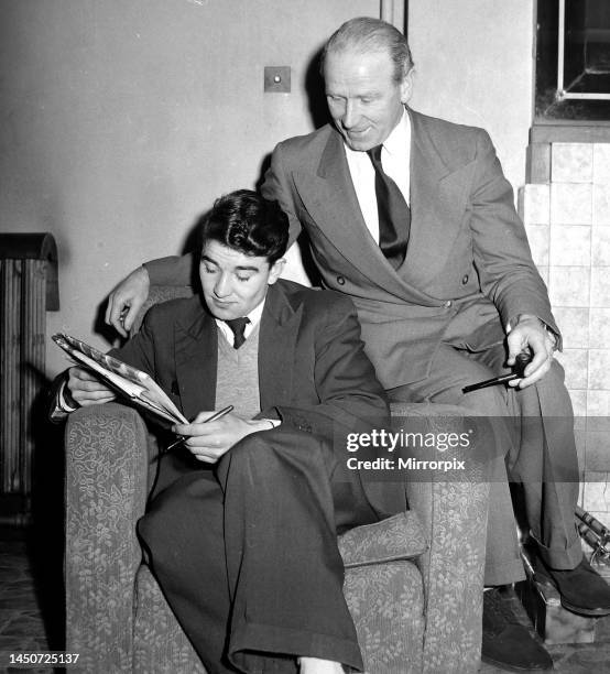 Manchester United team relaxing before a match. Jackie Blanchflower rarely joins the snooker players he prefers crossword puzzles. He is with manager...