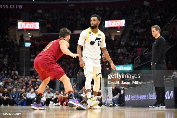 Dylan Windler of the Cleveland Cavaliers guards Mike Conley of the Utah Jazz as he brings the ball up court during the third quarter at Rocket...