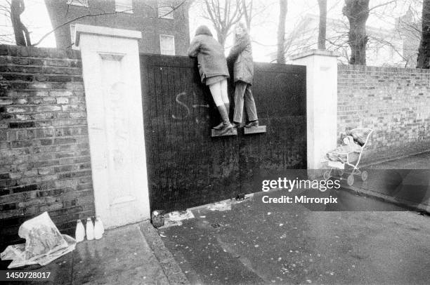 Fans climb up Paul McCartney's front gates of his St John's Wood, Cavendish Avenue homeon the day of his civil Wedding to Linda Eastman Picture taken...