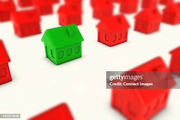 One Green House Amongst Many Red Houses, Foto stock