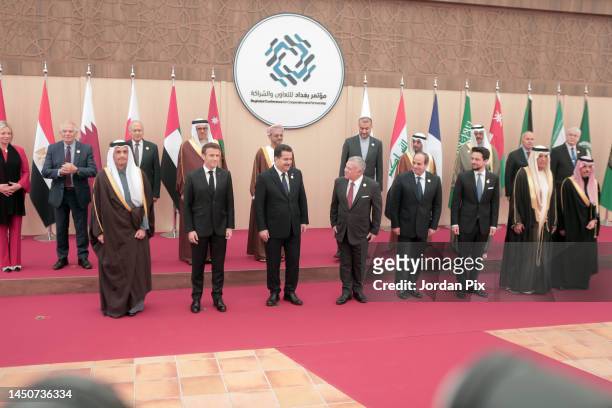 Participants stand for a family photo at the second Baghdad conference at the King Hussein convention centre on December 20, 2022 at the Dead Sea,...