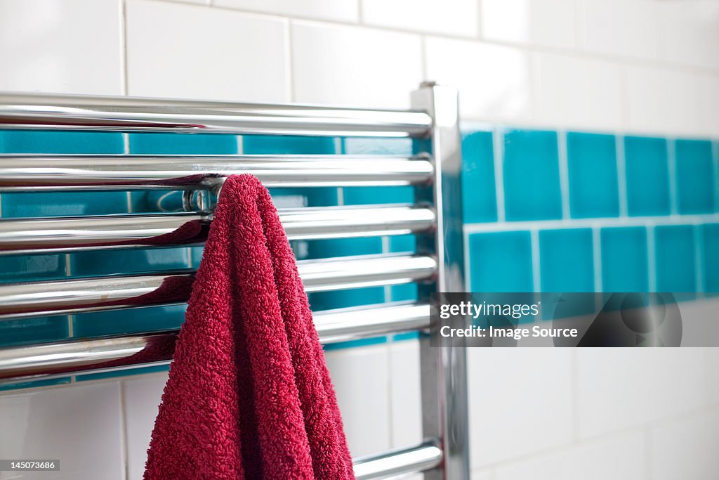 Towel hanging on a rail in bathroom