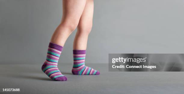 child wearing striped socks - human leg closeup stock pictures, royalty-free photos & images