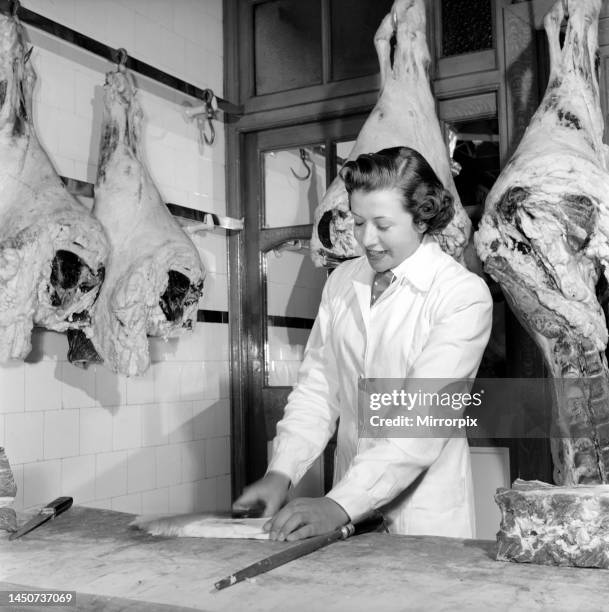 Female butcher seen here at work, 1954.