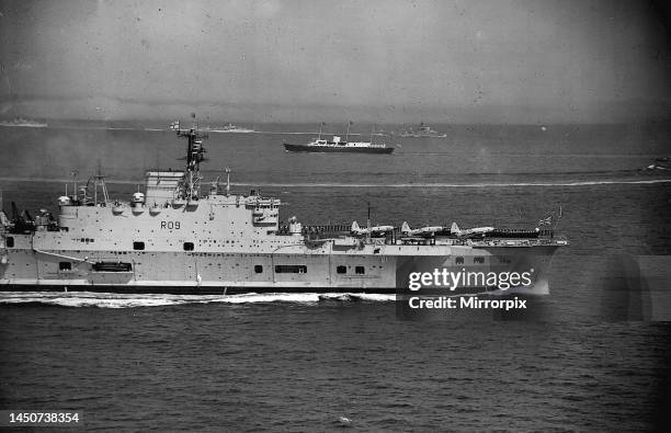 The Royal Yacht Britannia bringing back the Queen and Prince Philip after their State visit to Denmark, is met by the Royal Navy Home Fleet as they...