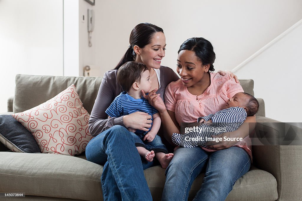 Two mothers with their babies