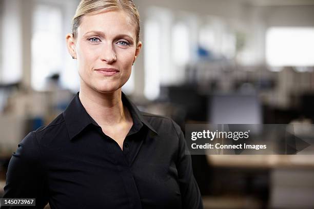 portrait of a businesswoman - woman black shirt stock pictures, royalty-free photos & images