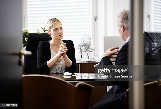 colleagues talking in office - open grave stock pictures, royalty-free photos & images