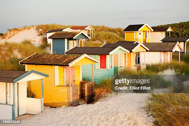 colorful bathing huts - beach cottage stock-fotos und bilder