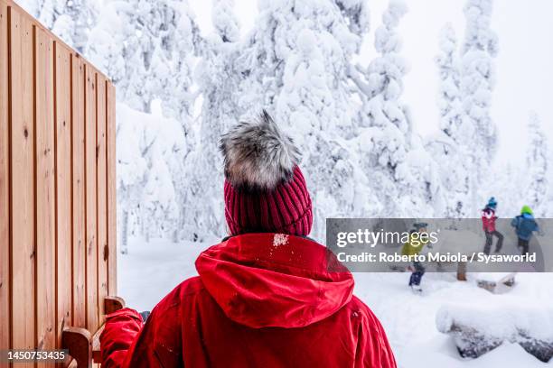 happy family enjoying playing in the snow, finnish lapland - finland happy stock pictures, royalty-free photos & images