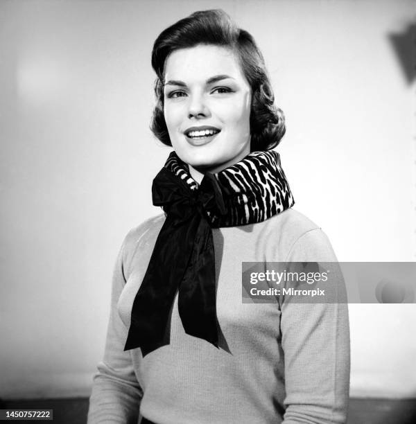 Model Mary Dixon wearing a bolster scarf to support the neck, 1957.