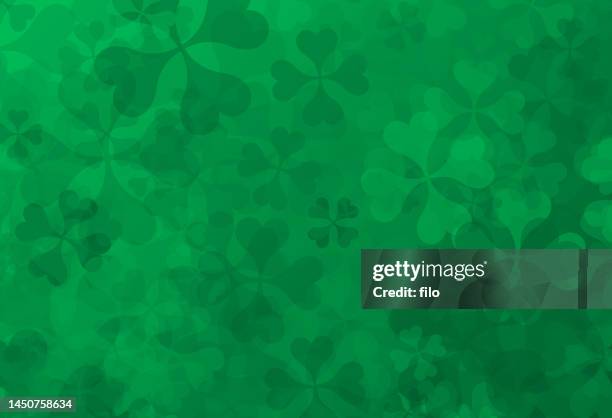 four-leafed clover shamrock st. patrick's day textured green background - 4 leaf clover stock illustrations