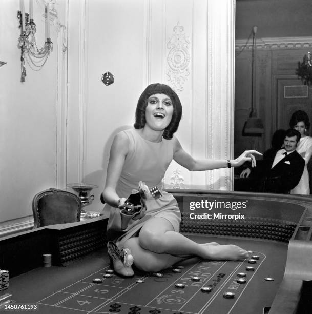 Singer Sandie Shaw has a flutter at a party she gave for shoe-retailers attending The British Shoe Week which opened at The Russel Hotel. 24th March...