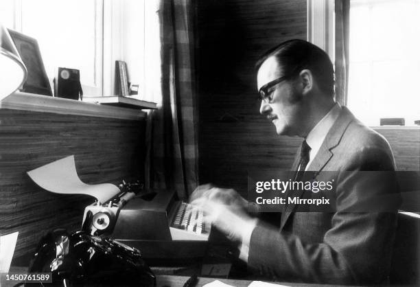 Alan Whicker, TV presenter, in his office at his Regent's Park Flat typing.