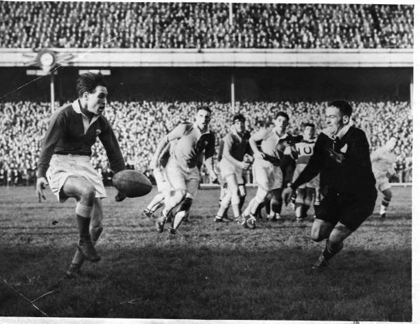 Welsh outside half Cliff Morgan kicks ahead in Wales 13-8 win against New Zealand at Cardiff in 1953. 19th December 1953.