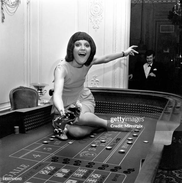 Singer Sandie Shaw has a flutter at a party she gave for shoe-retailers attending The British Shoe Week which opened at The Russel Hotel. 24th March...