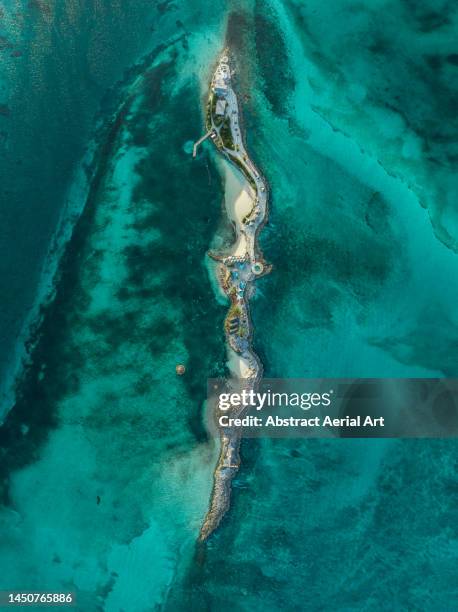 aerial image looking down on pearl island, bahamas - atoll stock-fotos und bilder