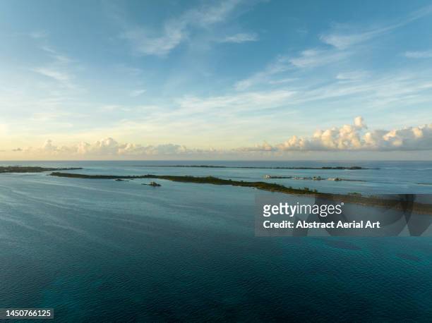 athol island at sunset photographed from an aerial point of view, bahamas - atlantic ocean fotografías e imágenes de stock