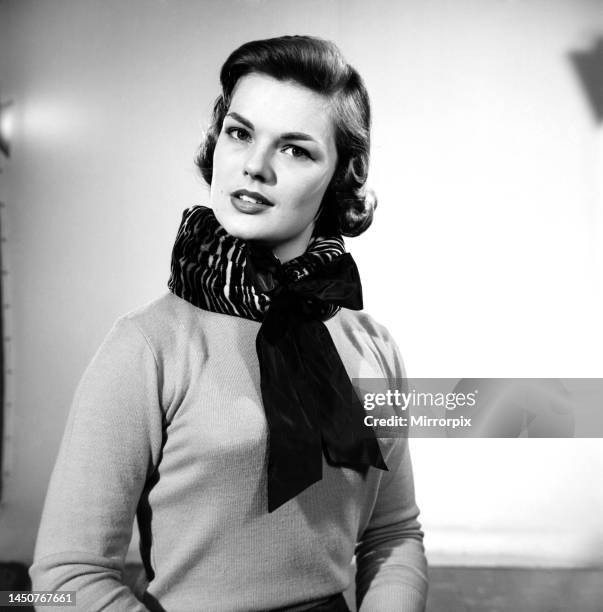 Model Mary Dixon wearing a bolster scarf to support the neck, 1957.
