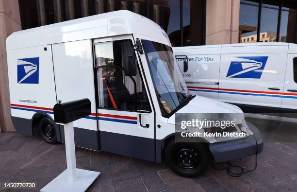 The United States Postal Service unveils two of its battery-powered vehicles at an event announcing its plan on implementing electric vehicles, at...