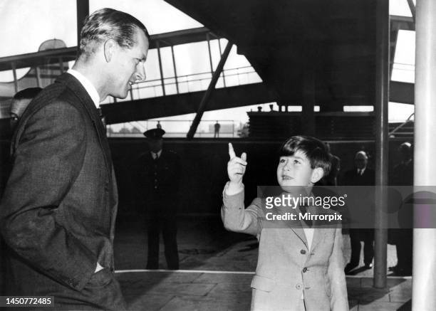 Prince Philip, the Duke of Edinburgh, is seen off by Queen Elizabeth II and his son Prince Charles at London Airport as he begins the first leg of...