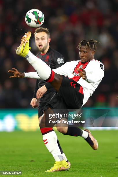 Mohammed Salisu of Southampton FC battles for the ball with Charles Vernam of Lincoln City FC during the Carabao Cup Fourth Round match between...